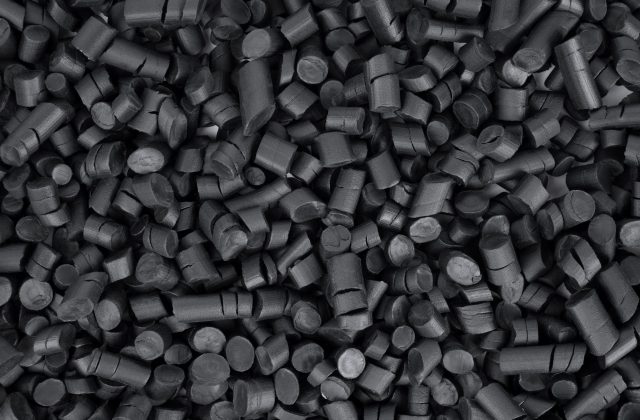 Black rubber granules background